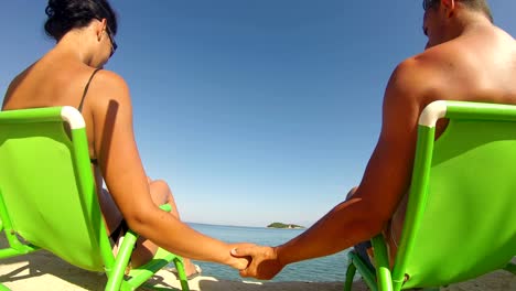 4k-SUMMER-HONEYMOON-ROMANCE,-Rromantic-touches-by-couple-in-bikinni-relaxing-honneymoon-at-ocean-resort