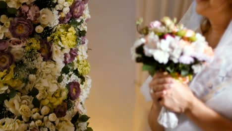 Bride-with-wedding-bouquet-of-flowers