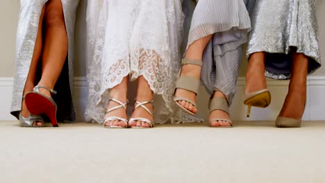 Bride-and-bridesmaids-show-off-their-shoes-4K-4k