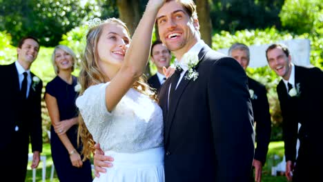 Happy-young-bride-and-groom-taking-selfie-with-family-4K-4k