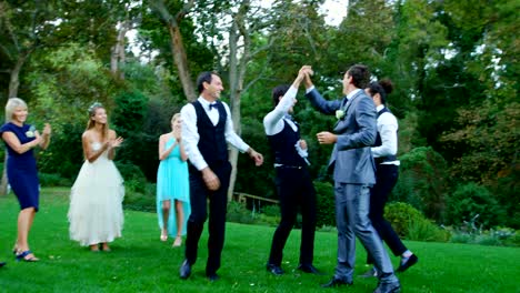 Groom-and-groomsmen-enjoying-catching-Garter-toss-4K-4k