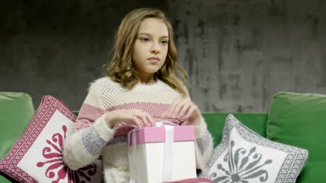 Unhappy-Sad-Teenage-Girl-Sitting-Open-Gift-Box