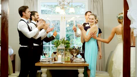 Bride-and-groom-walking-hand-in-hand-while-guests-applauding-4K-4k