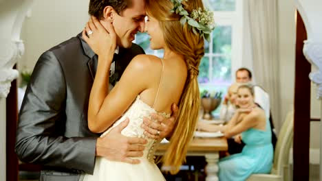 Bride-and-groom-dancing-while-guests-watching-them-4K-4k