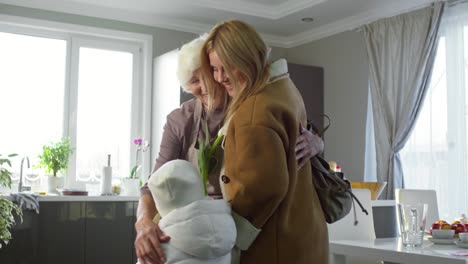 Daughter-and-Child-Arriving-at-House-of-Grandma-with-Flowers