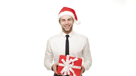 4k-Businessman-giving-present-to-camera-over-isolated-white-background.