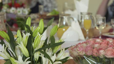 Close-up-of-festive-dinner-table-with-served-appetizers-and-beverages