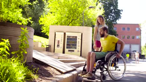 Young-disable-man-on-a-walk-in-the-park-with-his-wife