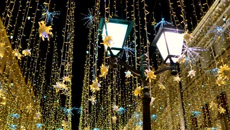 Street-lantern-with-decorative-Christmas-garlands.-New-year-and-Christmas-celebration.