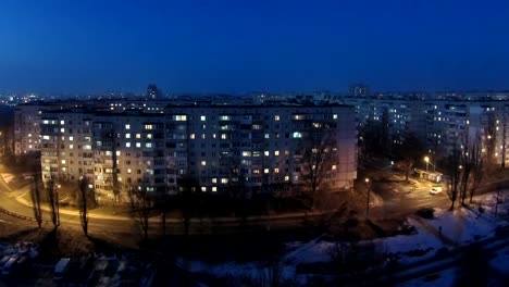 Timelapse-of-the-windows-of-a-multistory-apartment-building-during-sunset