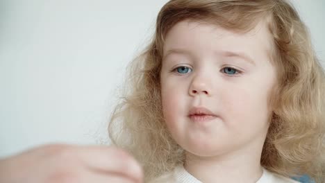 Little-girl-painting-Easter-eggs