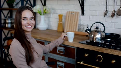 Smiling-disabled-woman-on-the-kitchen