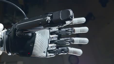 Artificial-intelligence-concept.-Cyborg-hand-moves-fingers,-robotic-equipment.