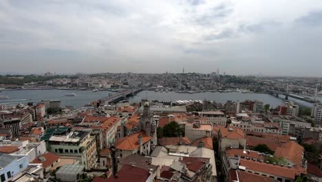 Great-panoramic-view-over-the-rooftops-of-Istanbul,-the-overcast-sky-and-the-streets-of-the-city,-beautiful-timelapse