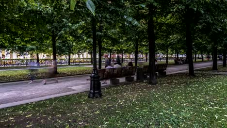 hyper-lapse-video-of-people-strolling-on-a-summer-day-along-the-Boulevard,-time-lapse