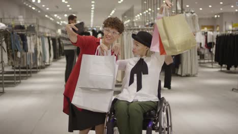 Paraplegic-Woman-and-her-Friend-Taking-Selfie-after-Shopping