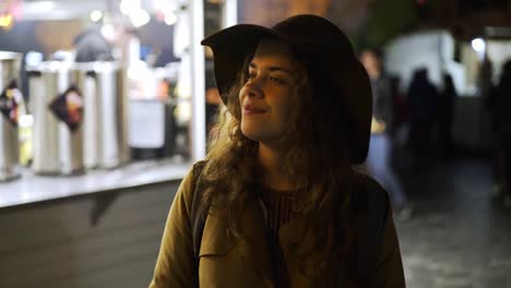 Tourist-girl-walking-on-european-easter-fair-at-night