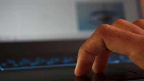 Close-up-shot-of-hands-of-a-female-using-laptop-via-touchpad