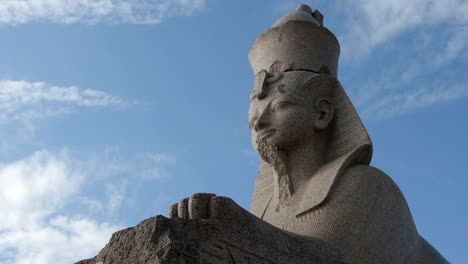 TIME-LAPSE:-Egyptian-stone-sphinx-and-a-clouds---St.-Petersburg,-Russia