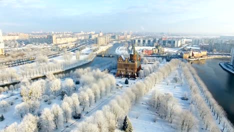 Aerial:-The-Cathedral-in-the-snow-capped-city-of-Kaliningrad,-Russia