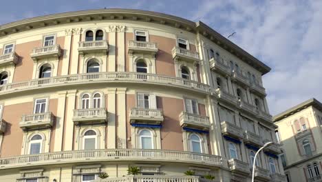 Beautifully-designed-semicircular-building-against-blue-sky,-architecture