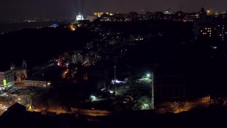 Aerial-shooting-night-city-Kiev-and-St-Andrew's-Church,-Europe,-Ukraine