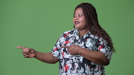 Overweight-beautiful-African-woman-against-green-background