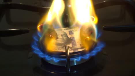 Burning-money---100-dollars-bill-burns-in-the-fire