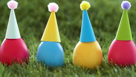 easter-eggs-in-party-caps-on-artificial-grass