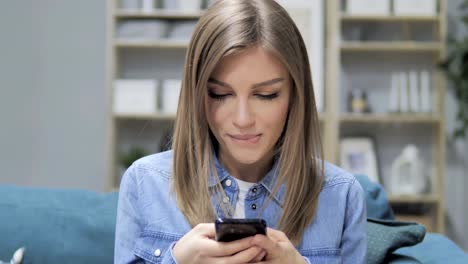 Young-Girl-Busy-Using-Smartphone-Applications