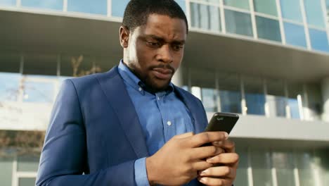 African-Businessman-Chatting-on-Phone