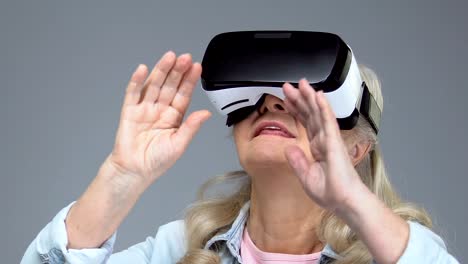 Mature-woman-wearing-virtual-reality-headset,-entertainment-device,-innovation