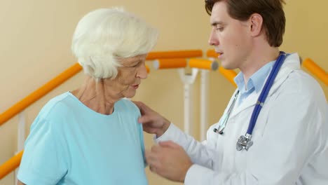 Physiotherapist-Examining-Elderly-Woman