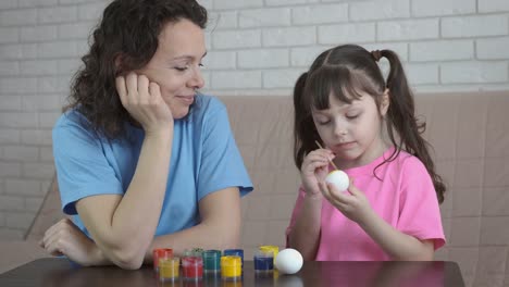 Easter-holiday.-Family-paints-eggs.