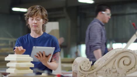 Woman-Working-on-Tablet-in-Joinery