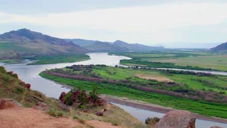 Summer,-day,-view-from-the-hill-over-the-river-with-a-rock-in-the-foreground