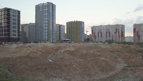 Aerial-view-of-the-area-with-new-residential-apartments-in-the-evening-at-sunset.-Cityscape.-The-construction-of-a-lot-of-apartment-buildings-reflects-urbanization-trends