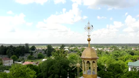 Flying-over-the-dome-of-the-Church.-The-bird-sits-on-the-cross-of-the-Church