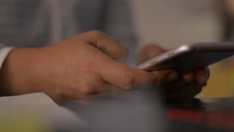 Close-up-woman-hands-texting-message-on-mobile-smart-phone-for-communication.