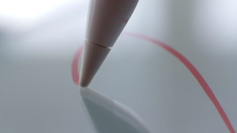 Macro-Follow-Shot-of-an-artist-hand-drawing-on-a-digital-tablet-with-pencil.-Pencil-is-Connected-to-the-Camera.-Gripped-Shot.