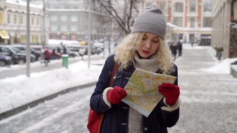 Young-curly-woman-traveling-in-city