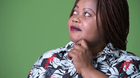 Overweight-beautiful-African-woman-against-green-background