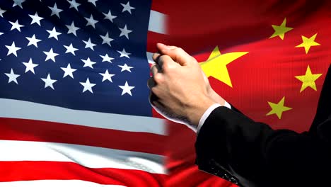 United-States-sanctions-China,-chained-arms,-political-or-economic-conflict