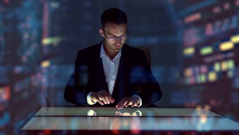 The-man-working-with-touchscreen-display-on-the-hologram-background