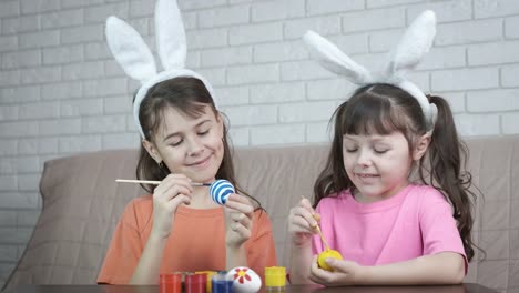 Easter.-Children-paint-eggs.