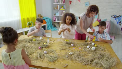 Multi-ethnic-Children-Decorating-Easter-Eggs-in-Art-Class