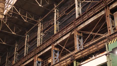 Old-Industrial-Hall-with-Metal-Beams-Under-Ceiling