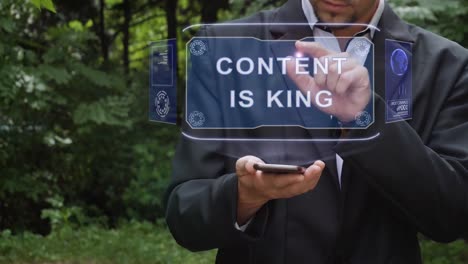 Businessman-uses-hologram-with-text-Content-is-King