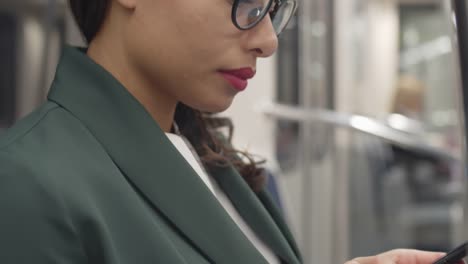 Woman-Using-Cellphone-in-Public-Transport