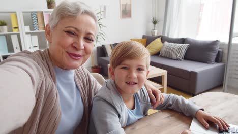 Aged-Woman-Making-Selfie-with-Grandson